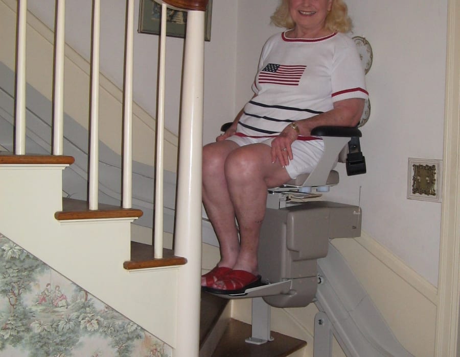 Woman riding a stairlift